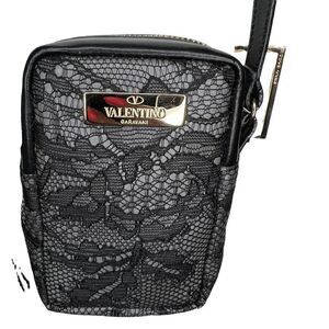 NWT Valentino Garavani lace mini bag. Valentino logo outside. Zipper on top. 3x4